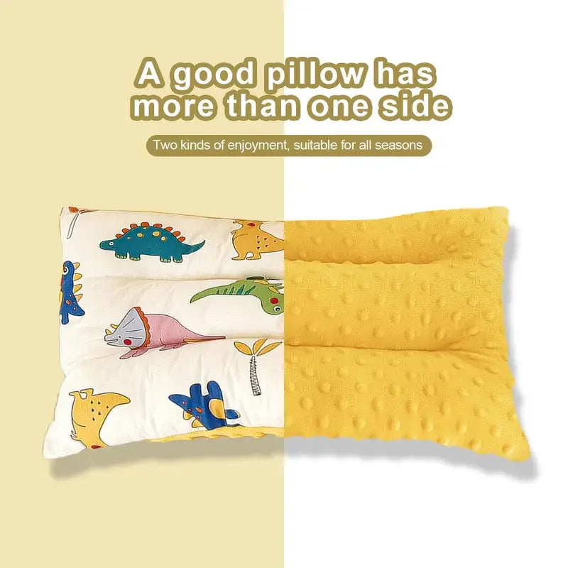 A reversible fiber pillow featuring cartoon animals on both sides for infants.