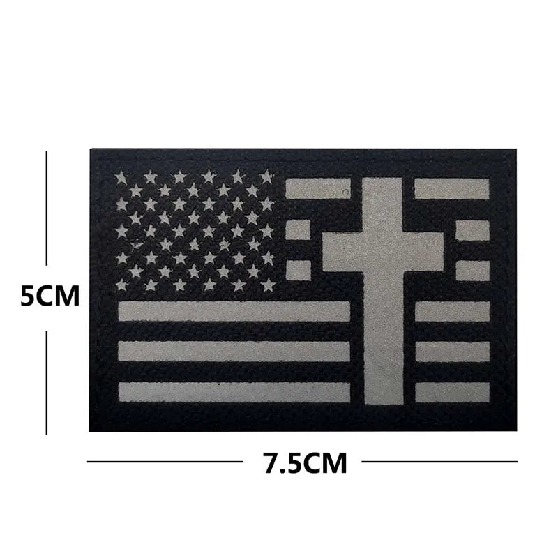 Black embroidered patch featuring a flag design with stars and a cross symbol.