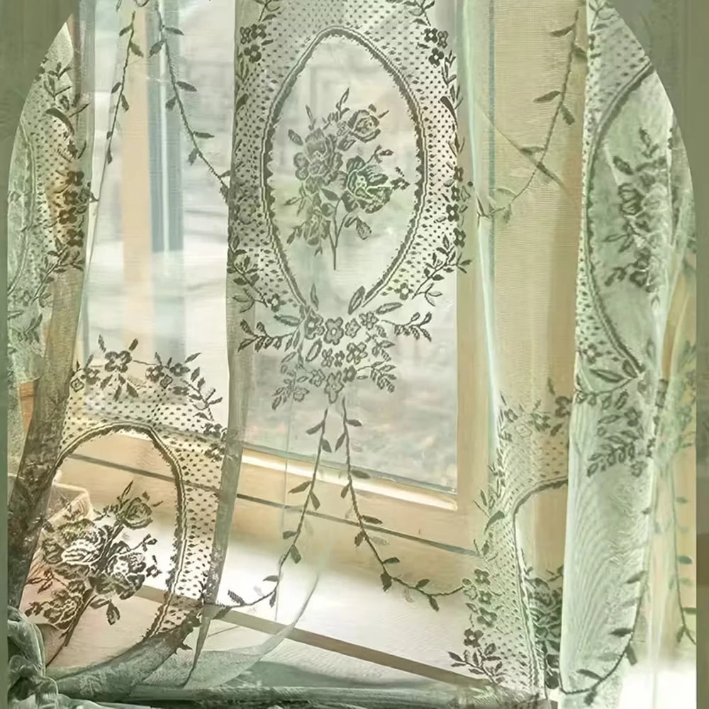 Sheer lace floral window curtain with delicate greenery patterns filtering light