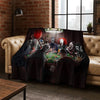 A dark flannel throw blanket featuring various horror characters and figures.