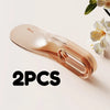 Two rose gold silicone mattress lifters or bed linen organizers shown on a light background.