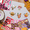 A collection of colorful, fun face-changing DIY stickers featuring food items like ice cream, popcorn, and hamburgers.