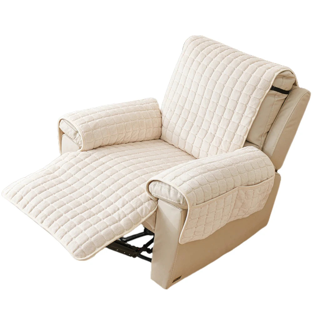 A beige quilted stretch recliner cover with storage pockets shown from the side.