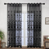 Black sheer curtain featuring pearl and lace embroidery hanging in a doorway.