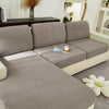 A modern gray jacquard knit sofa cushion cover with light beige accents and a textured pattern.