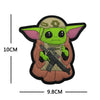A plush embroidered patch of Grogu from Star Wars wearing tactical gear.