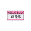 A lapel pin featuring the text HELLO I'M A BLINK on a pink and white rectangular background.