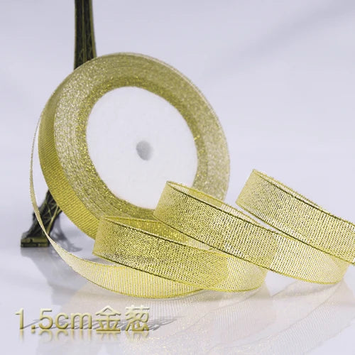 Roll of gold glitter organza ribbon for gift wrapping and DIY crafts