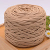 A ball of beige craft yarn made from 100% polyester for knitting and DIY projects.