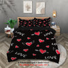 Black duvet cover with red heart patterns and two pillowcases displayed on a bed.