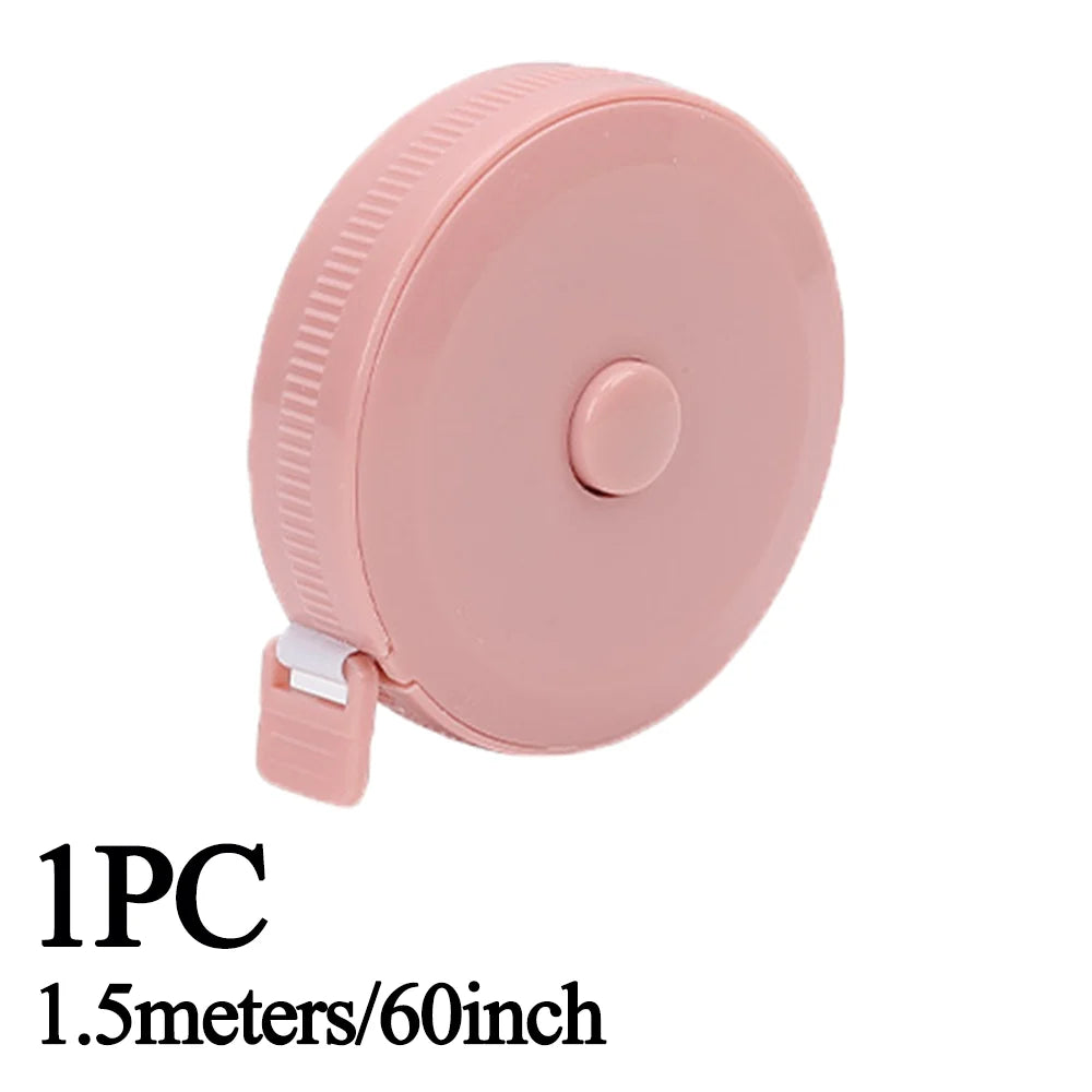 Pink retractable double-sided measurement tape, 1.5 meters long.