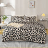 A luxury leopard print duvet cover set displayed on a bed with natural light and decorative elements.