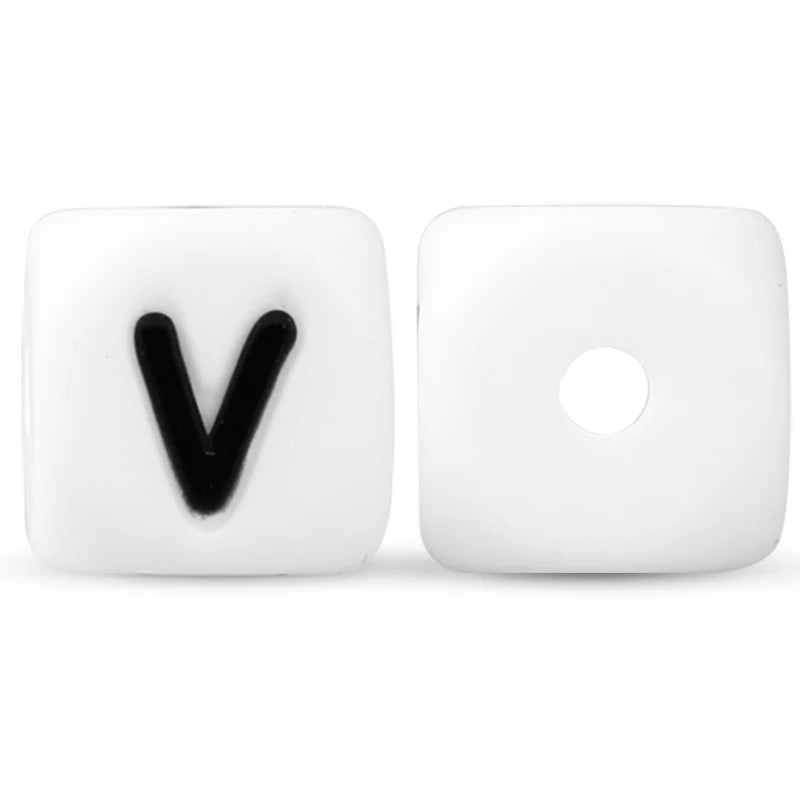 Two white silicone alphabet beads, one shaped like the letter V and the other as a circle.