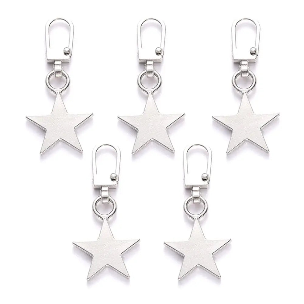 A set of five silver star-shaped zipper pull replacement kits for bags and zippers.