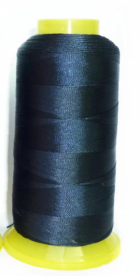 A spool of black high tenacity polyester sewing thread with a yellow plastic core.