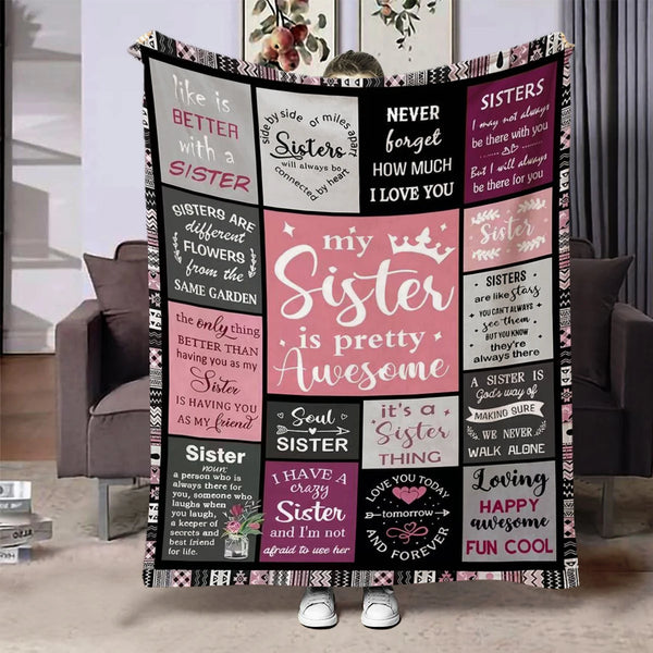 A black and pink flannel throw blanket featuring quotes about sisters and sisterhood