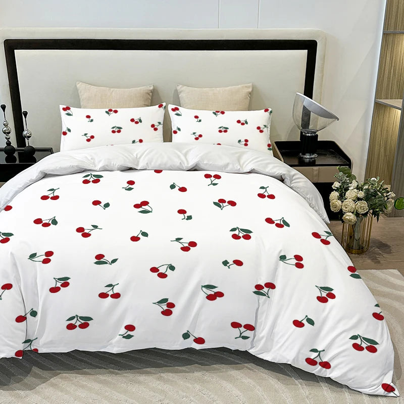 White duvet cover set featuring a fruit print design with red and green cherries.