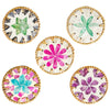 A set of five decorative woven shell coasters featuring various floral patterns in white and pink tones.