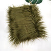 A swatch of olive green faux fur plush fabric used for sewing and crafting.