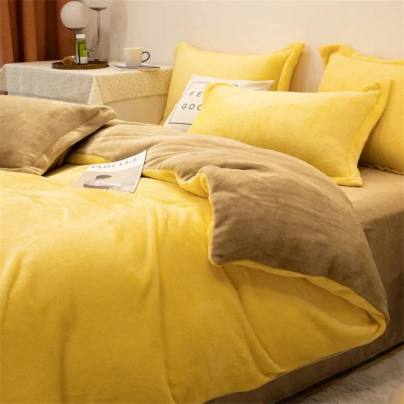 A yellow and brown luxurious flannel duvet cover set displayed on a bed with pillows and a bedside table.