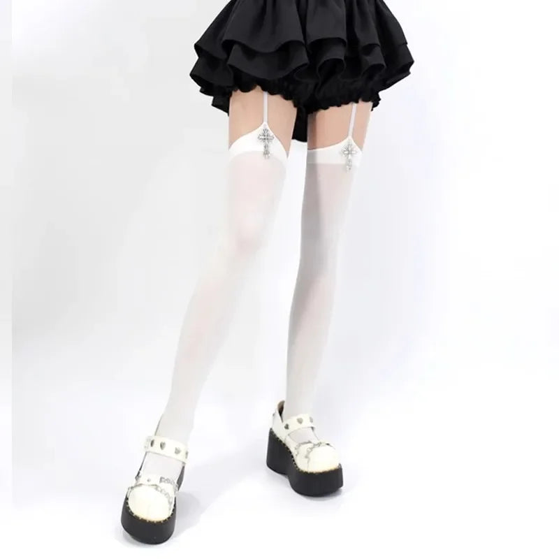 A person wearing black ruffled fabric and white suspender socks with cross details.