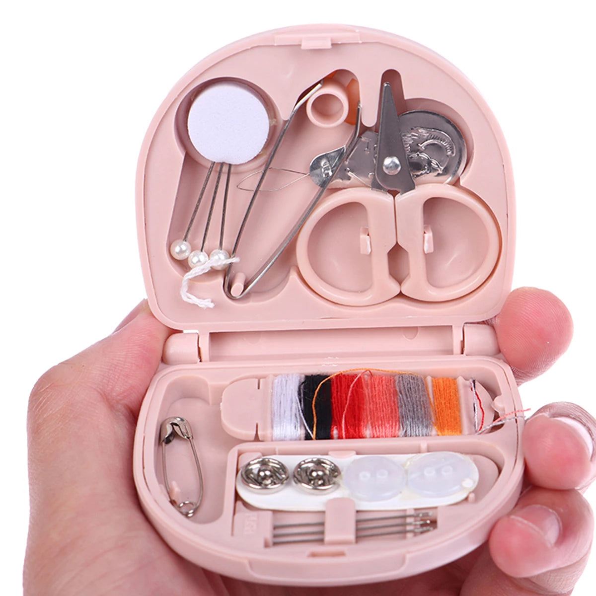 A pink portable DIY sewing box is shown open, containing various sewing tools and colored threads.