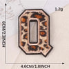 A leopard print iron-on patch shaped like the letter O, measuring 6cm high and 4.6cm wide.