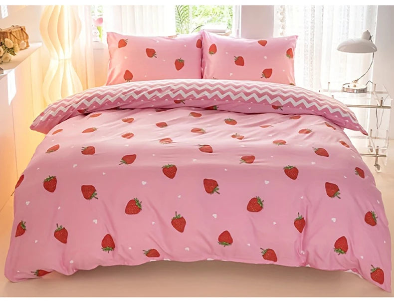 Pink duvet cover set with a strawberry print featuring pink and white accents.