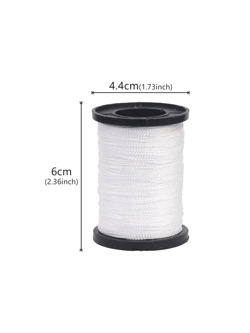 A roll of white sewing thread or cord, measuring 6cm long and 4.4cm in diameter.