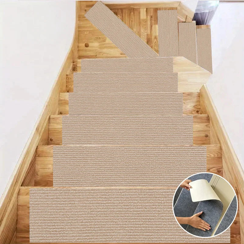 A wooden staircase features self-adhesive mats in beige and gray tones for grip and protection.