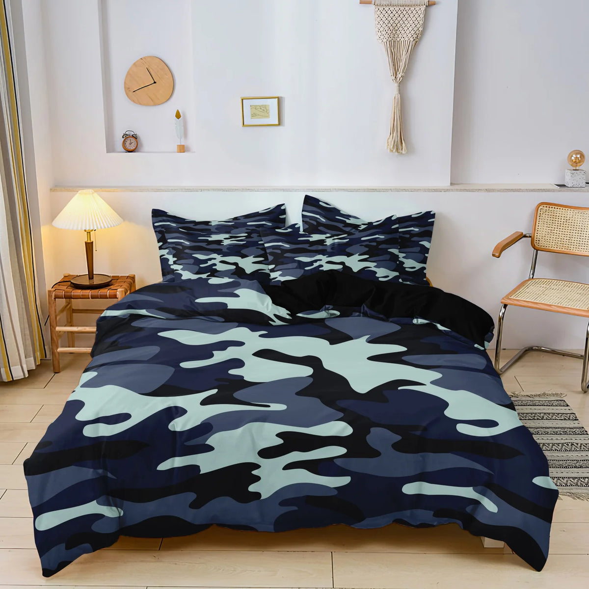 A dark blue and green camouflage digital print duvet set displayed on a bed with wooden side tables and wall decor.