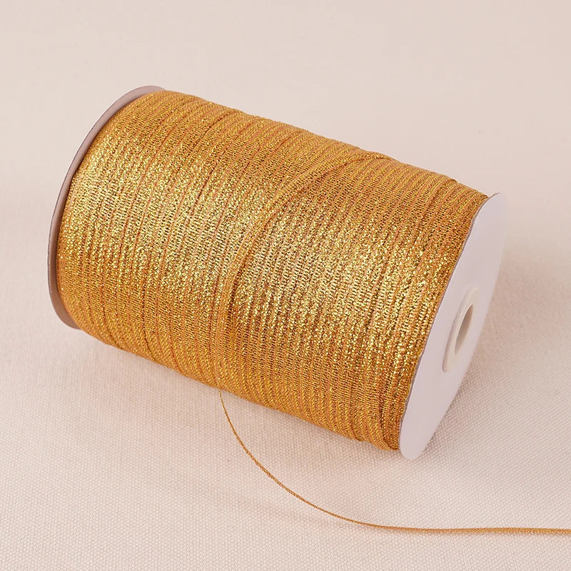 A roll of 10-meter gold and silver glitter satin ribbon is shown on a light background.