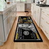 A black non-slip door mat featuring a funny dollar print for an entryway or kitchen.