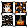 A set of four black pillow covers featuring Halloween designs including ghosts, pumpkins, and bats.