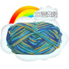 A ball of 17-ply premium milk cotton yarn with a rainbow background.
