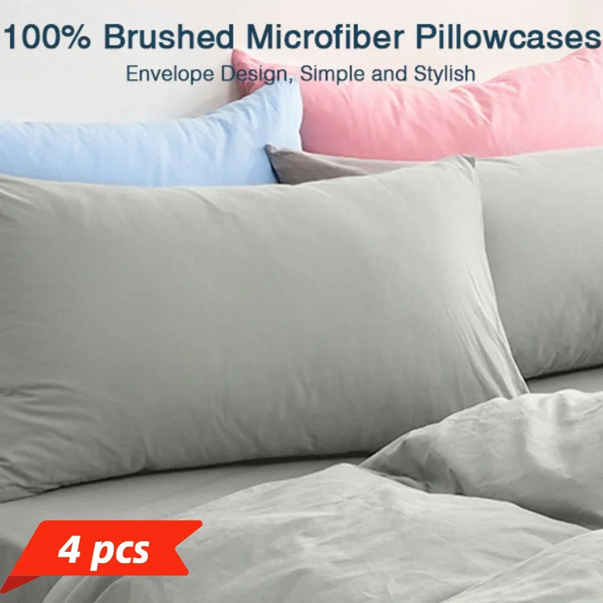 A set of four gray microfiber pillowcases displayed on a bed.