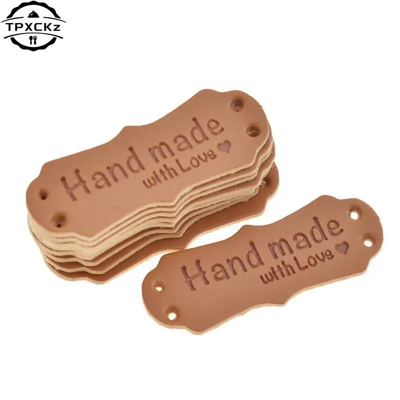 50 pieces of brown PU leather embossed tags with the text Hand made with Love for crafting