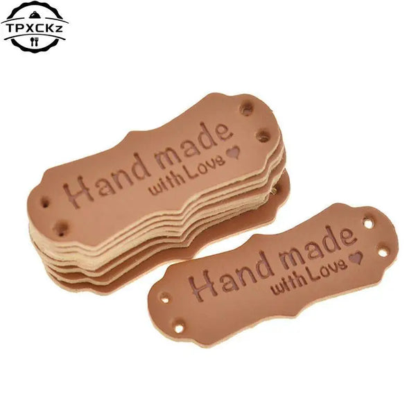 50 pieces of brown PU leather embossed tags with the text Hand made with Love for crafting