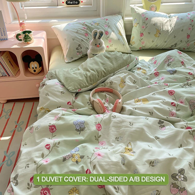 A light green and white duvet cover set featuring a floral pattern with small animal motifs.