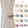 A set of minimalist magnetic ball curtain tiebacks in various colors, including gold, silver, and blue.