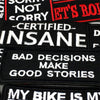 A collection of black embroidered patches featuring text such as NOT SORRY, CERTIFIED INSANE, and BAD DECISIONS MAKE GOOD STO