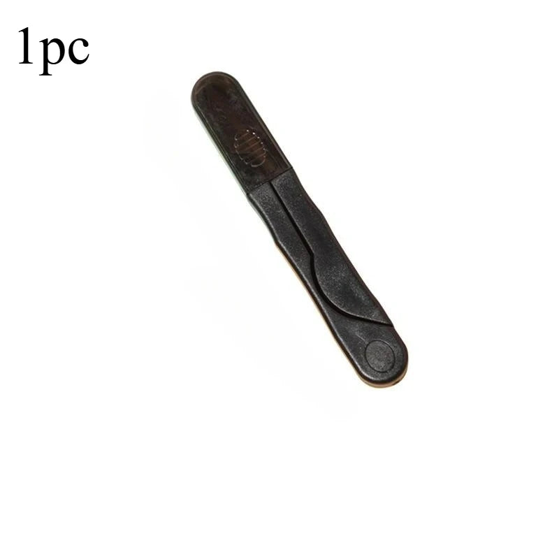A single stainless steel sewing and embroidery scissors set with a dark handle.