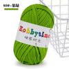 A ball of bright green thick polyester craft yarn for knitting and crochet