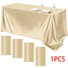 Luxury rectangle satin tablecloth set with gold accents and matching cylindrical candle holders