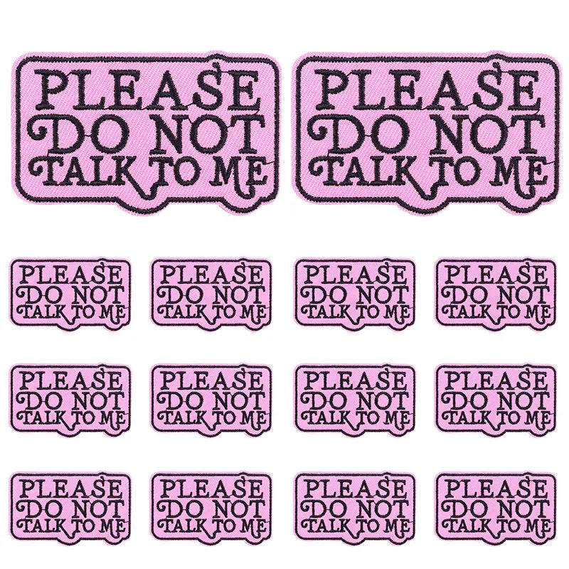 A set of pink embroidered letter slogan applique patches with the text Please do not talk to me