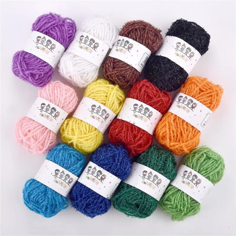 A collection of twelve different colored soft acrylic yarn skeins for knitting projects.
