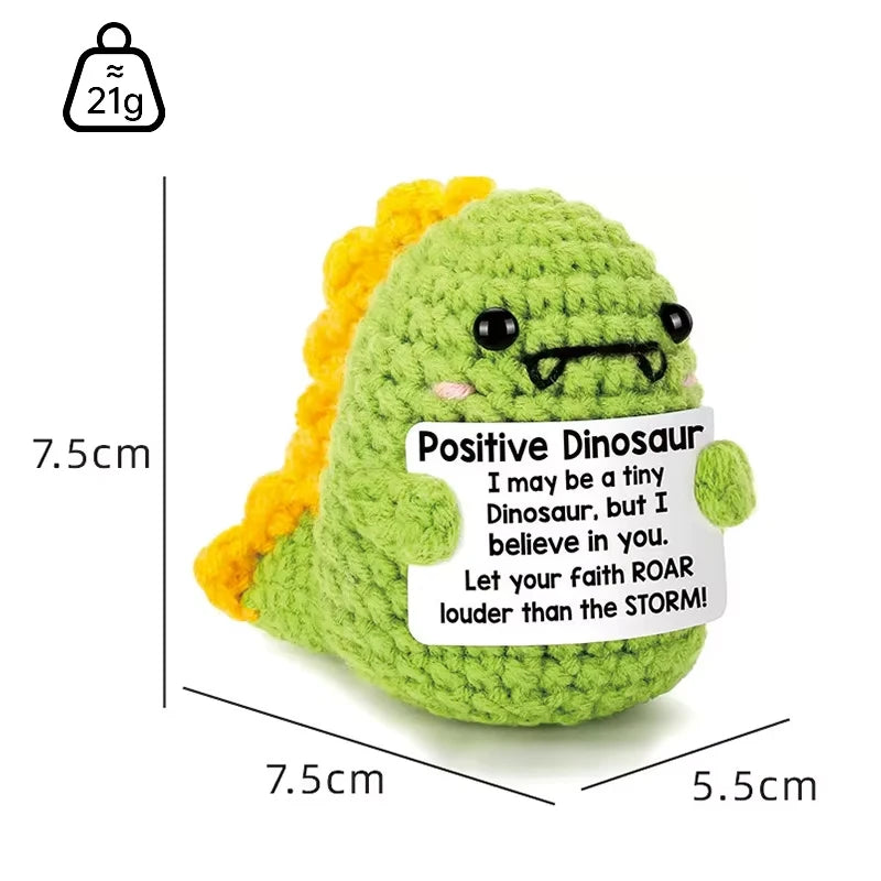 Handmade plush dinosaur toy in green with yellow accents