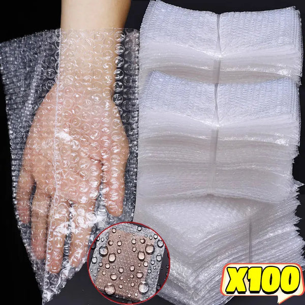 Clear bubble mailers showing a hand wrapped in protective clear plastic and a stack of white bubble wrap.