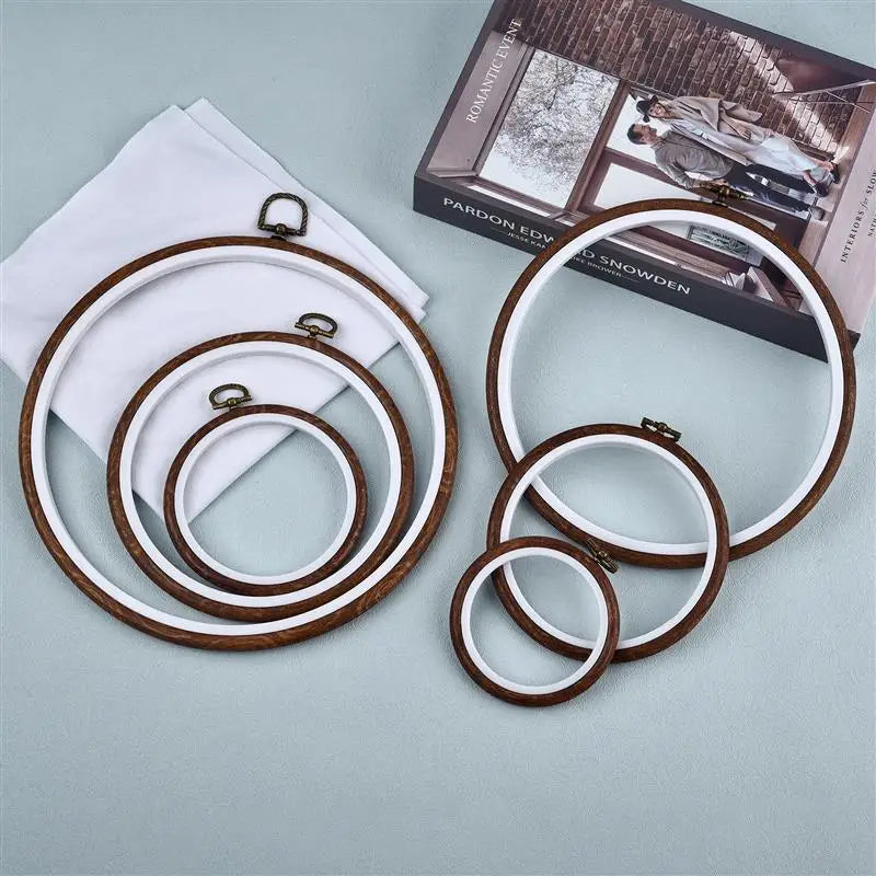 Set of round wooden embroidery hoops in white and brown wood for cross stitch projects