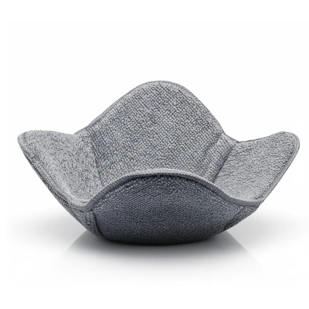 A gray quilted microwave bowl cozy designed as a heat resistant insulated holder.